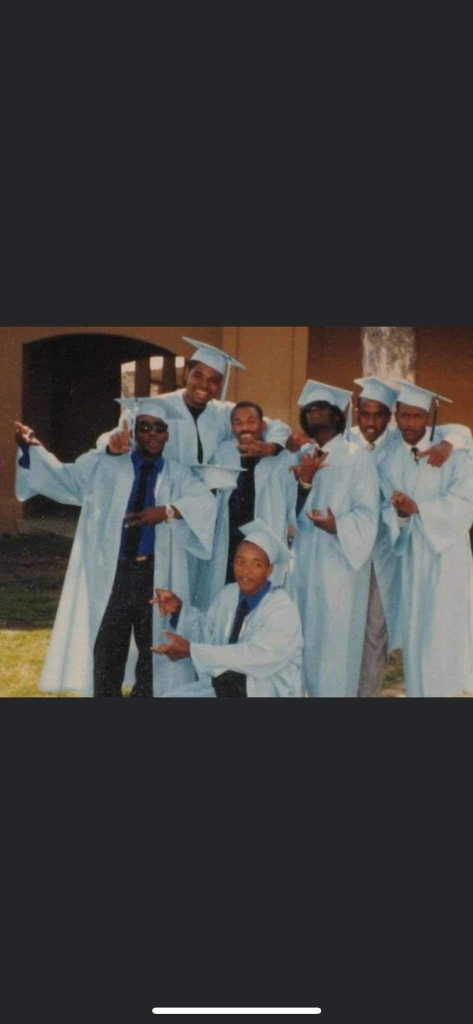 WPHS Class of 87 graduates celebrating in caps and gowns