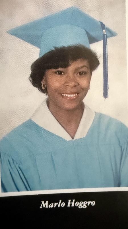 Marlo Hoggro graduation portrait in cap and gown