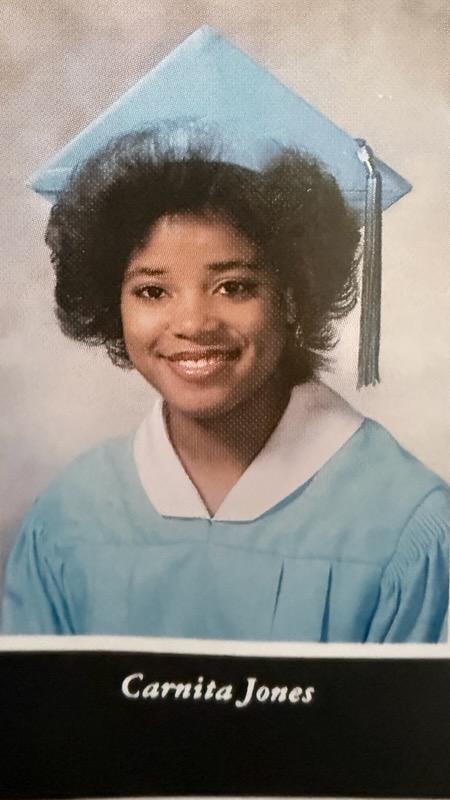 Carnita Jones graduation portrait in cap and gown