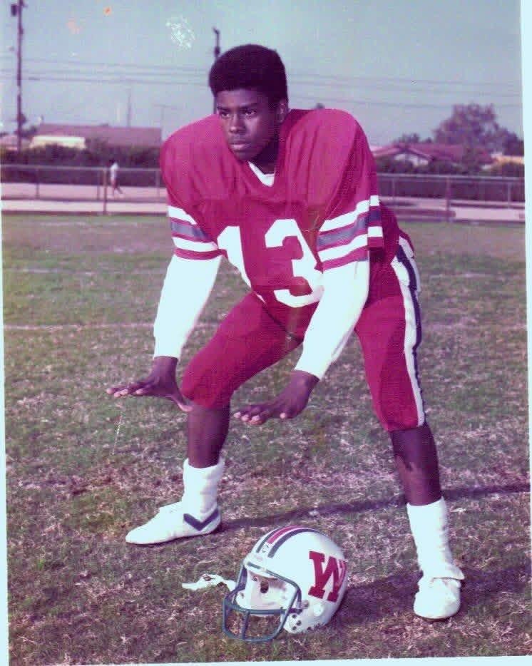 Washington Generals football player wearing number 13 jersey posing on the field with helmet