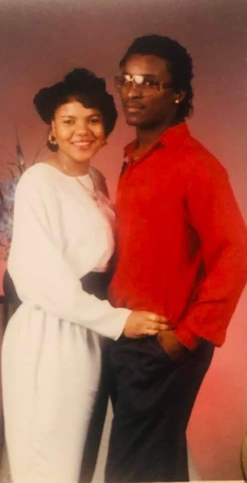 Couple posing together in formal attire
