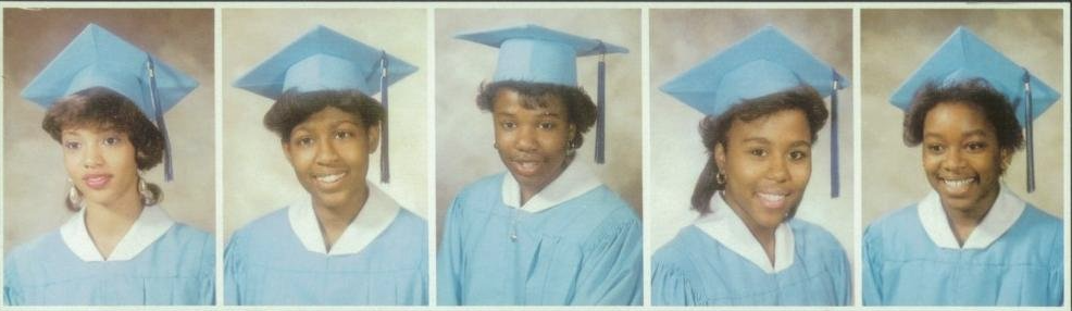 Five graduates side by side in light blue caps and gowns