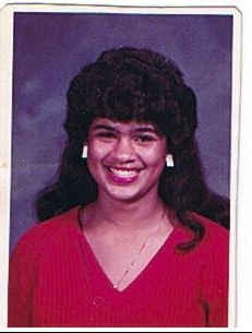 Young woman in red top yearbook portrait