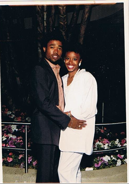 Couple posing together outdoors at a reunion event
