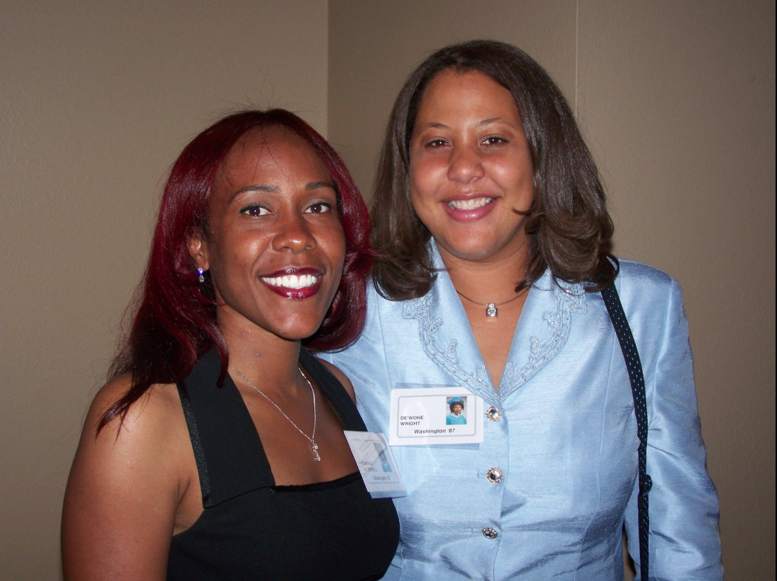 De'Wone Wright and a classmate smiling together at a reunion event
