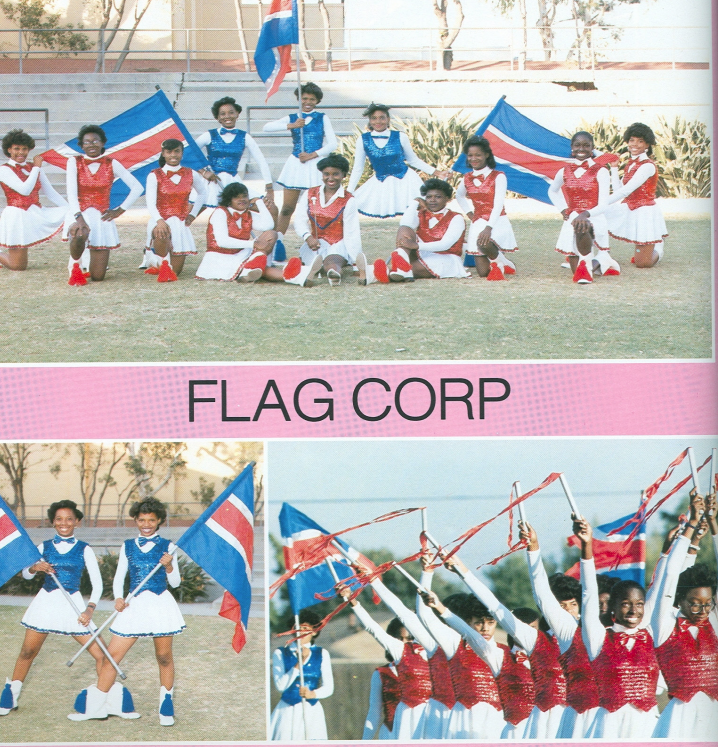 Washington Prep Flag Corp members in red and white uniforms performing with blue red and white flags